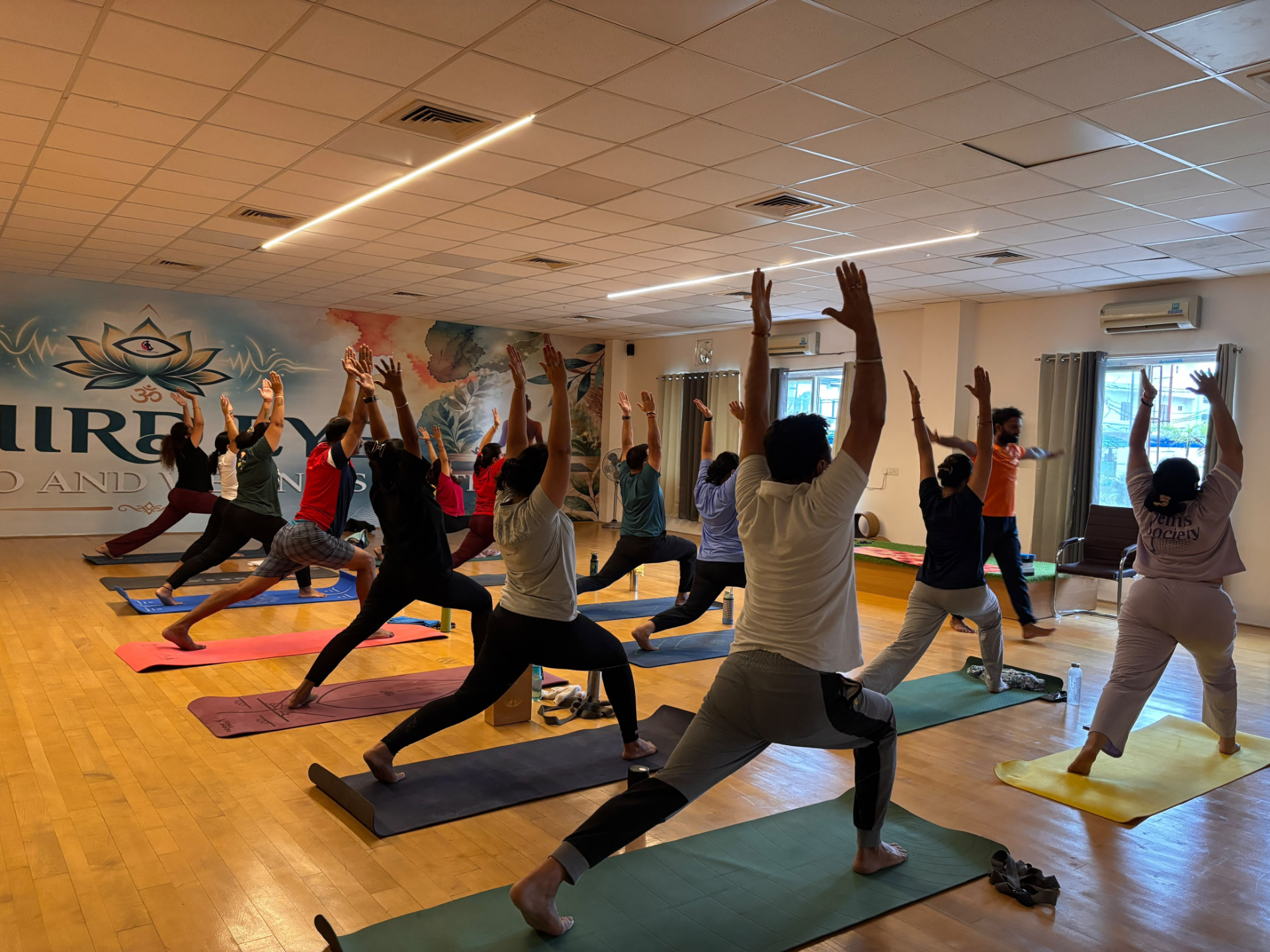 Group yoga practice inside Third Eye Yoga Studio